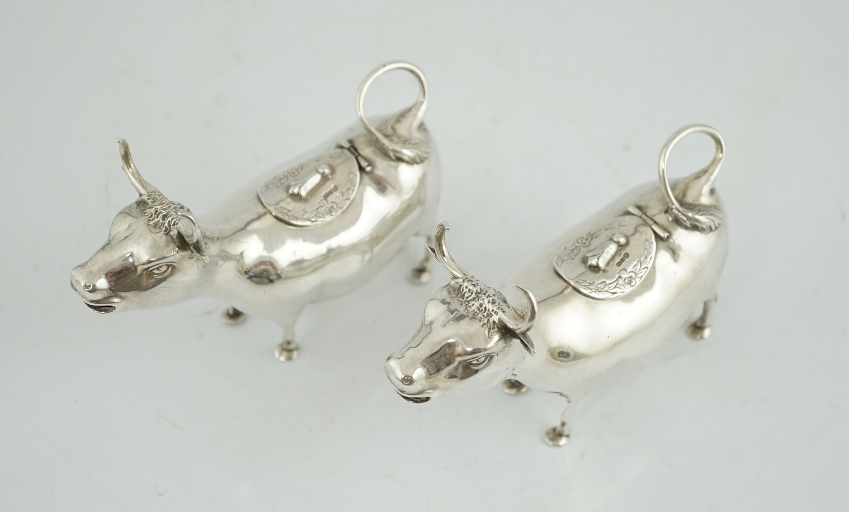 A pair of early 20th century continental silver cow creamers, by Berthold Muller